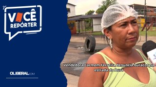 Vendedora Carmem Ferreira denuncia buracos na estrada do Aurá