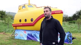 Lifeboat transformed into Yellow Submarine glamping pod