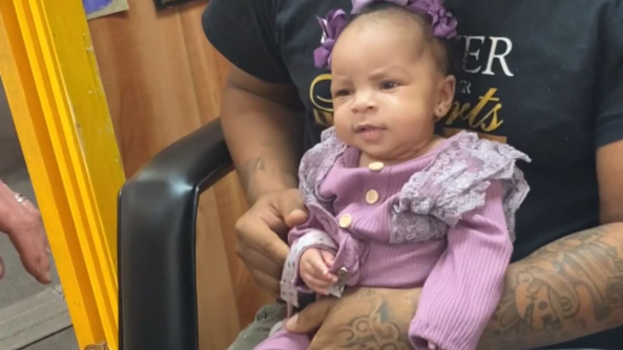 Baby is NOT A FAN of getting her ears pierced