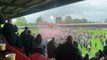 Crawley Town fans invade the pitch after the Reds secure a play-off place