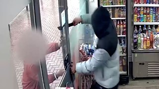 CCTV shows machete thug raiding shop before being locked inside by hero shopkeeper