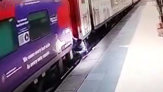 Quick-thinking worker saves life of passenger who fell between tracks and a train