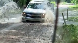 Pickup Truck Falls Into Washout While Crossing Flooded Road