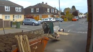 Funny moment gardener's wheelbarrow tips over - covering him in soil