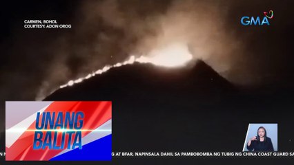 Grassfire Erupts Between Two Hills of Chocolate Hills