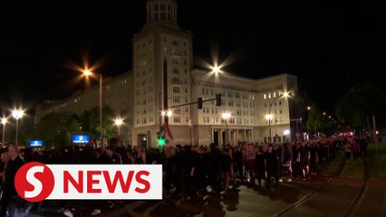 Thousands of peaceful demonstrators celebrate the eve of May Day in Berlin