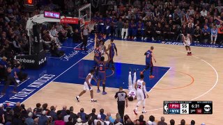 Embiid finds a way to score as he tumbles into traffic