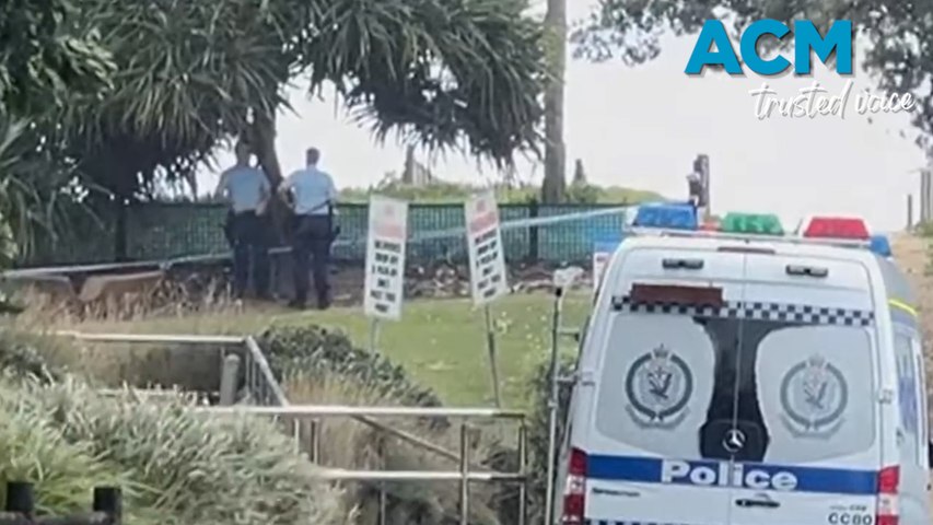 Police are searching for a suspect after a 22-year-old man was fatally stabbed near the Coffs Harbour surf  club carpark at around 6.30am on May 2, 2024.