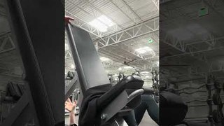 Woman Working Out With Dumbbells Accidentally Slides Off Bench and Falls