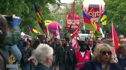 Paris marks Intl Workers  Day_ Main unions lead the march demanding better pay