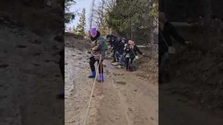 Woman Slips and Falls on Steep Muddy Track