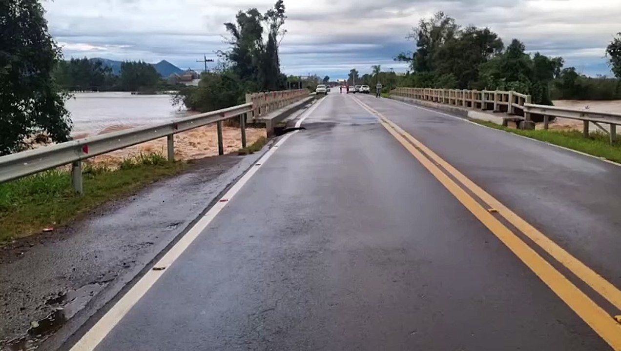 Bridge collapses and falls into river