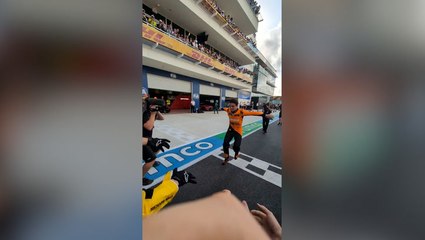 Lando Norris crowd surfs in behind the scenes footage from first F1 win