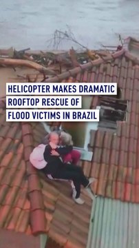 Helicopter makes dramatic rooftop rescue of flood victims in Brazil