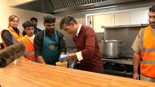 PM helps out in the kitchen with food charity
