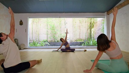 mixkit-yoga-practice-between-three-people-43737-medium