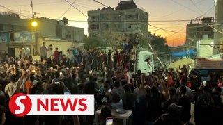 Gazans celebrate yet remain cautious after Hamas' acceptance of truce with Israel