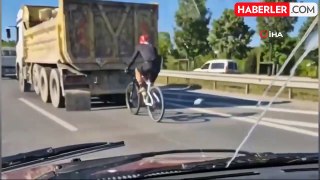 Bisikletli sürücünün hafriyat kamyonu arkasında tehlikeli yolculuğu kamerada