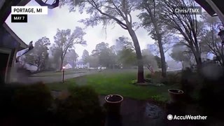 Surveillance video captures moment that a Michigan tornado levels all the trees in a yard