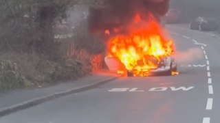Man drives past TVR FULLY ENGULFED in FLAMES outside primary school