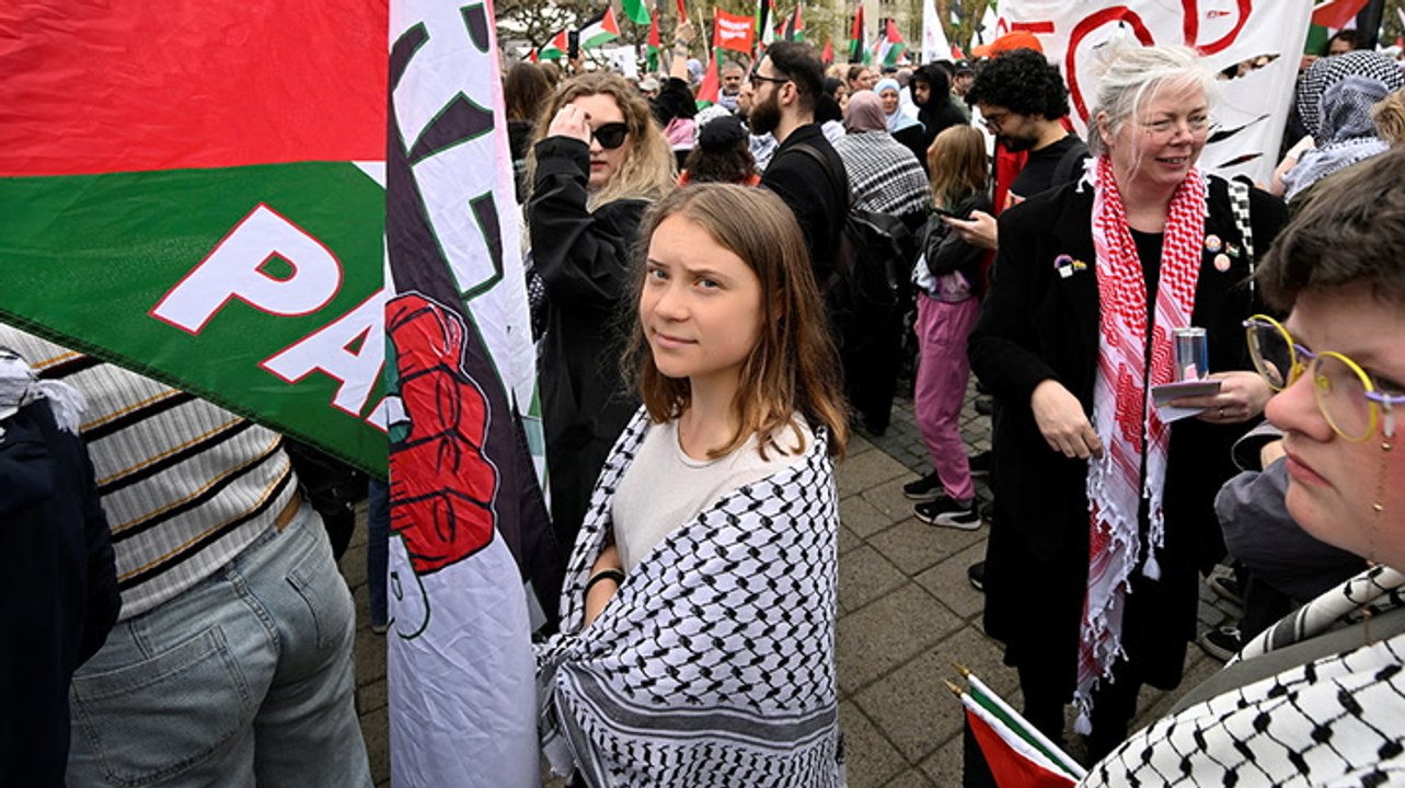 Greta Thunberg joins thousands protesting again...