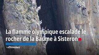 La flamme olympique escalade le rocher de la Baume à Sisteron