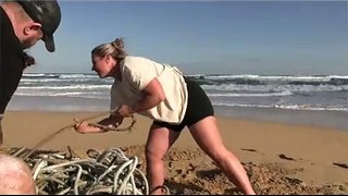 Strong men and women take on beach challenge