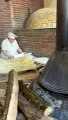 Baking Armenian Lavash bread and barbecue in traditional style
