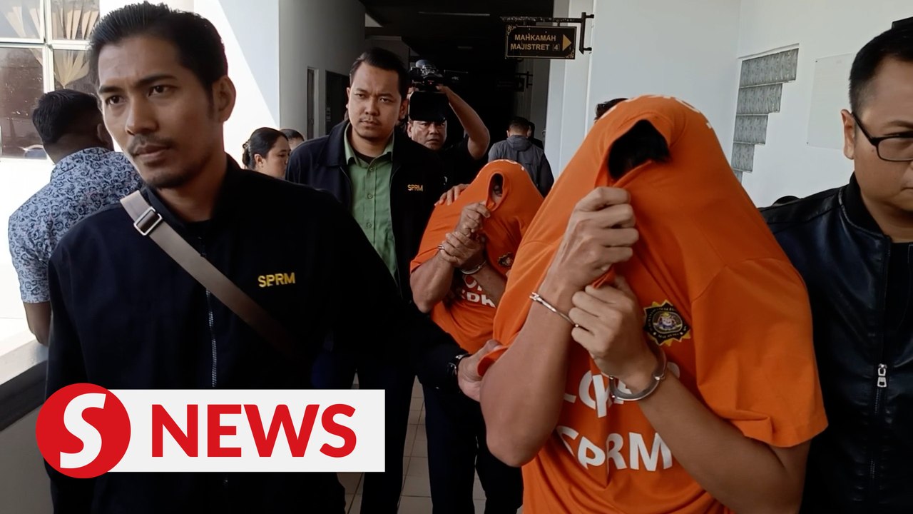 Two enforcement officers arrested for accepting bribe