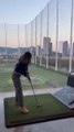 Girl Repeatedly Fails Hitting Golf Ball at Driving Range