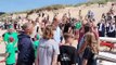 Prince William talks to surf life saving club members at Fistral Beach