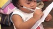 Adorable Toddler Imitates Fourth Grade Aunt Writing on Paper