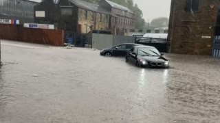 Bradford, UK: Cars left stranded in floodwaters amid relentless rain