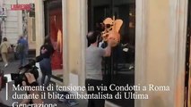 Blitz di Ultima Generazione a Roma, addetto alla sicurezza di un negozio prende a calci attivista