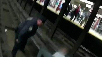 Moment police rescue man on New York subway tracks