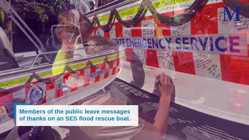 The community were invited to scrawl messages of thanks to SES volunteers in black texta on an SES flood rescue boat in the Wollongong CBD on Friday, May 17, 2024. Video by Nadine Morton