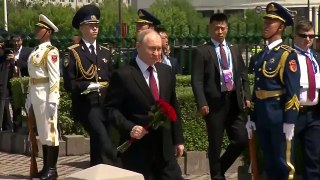 Putin visits Soviet martyrs monument during China trip
