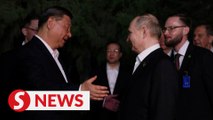 Putin and Xi embrace in Beijing to seal strategic partnership