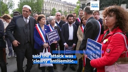 Hundreds gather in Paris to light candles after synagogue attacked