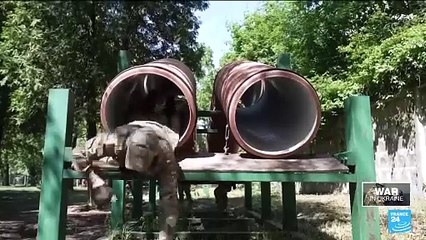 Ukraine starts conscripting younger men for war as battles continue around Kharkiv