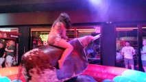 Mechanical Bull Benidorm - Girl in beautiful dress rides bull!
