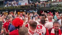 Crawley Town players celebrate with fans at BOXPARK