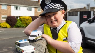 Autistic lad wears police outfit to keep town safe