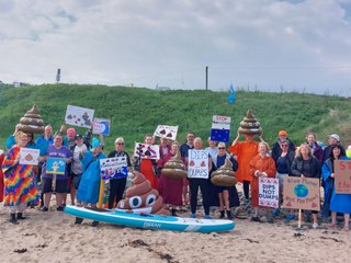 People gathered on Cresswell Beach for a national protest