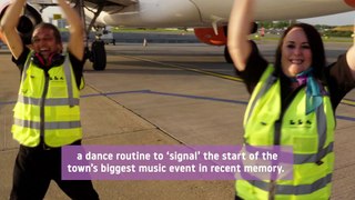 Airport ground handlers perform lively dance routine on runway