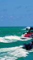 Cigarette boat yesterday smoothly handling the wake of a fancy boat and a police boat at the Haulover Inlet in Bal Harbour, Florida