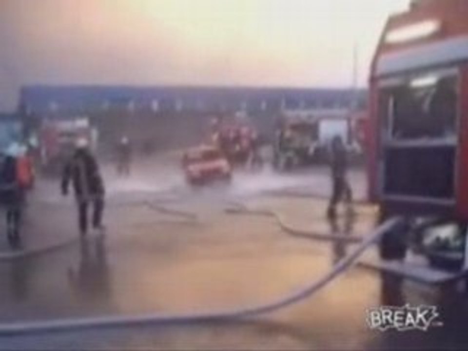 Firemen Lift Car With Hose Water
