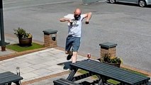 Hilarious moment man saves his pint from 'mini tornado' in pub beer garden