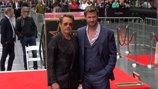 Chris Hemsworth at his Hollywood Walk of Fame star ceremony with Robert Downey Jr.