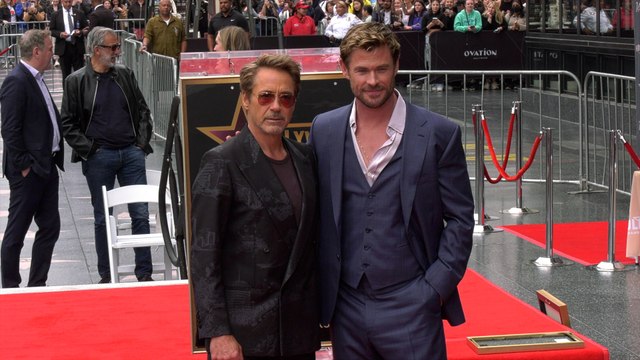 Chris Hemsworth at his Hollywood Walk of Fame star ceremony with Robert Downey Jr.